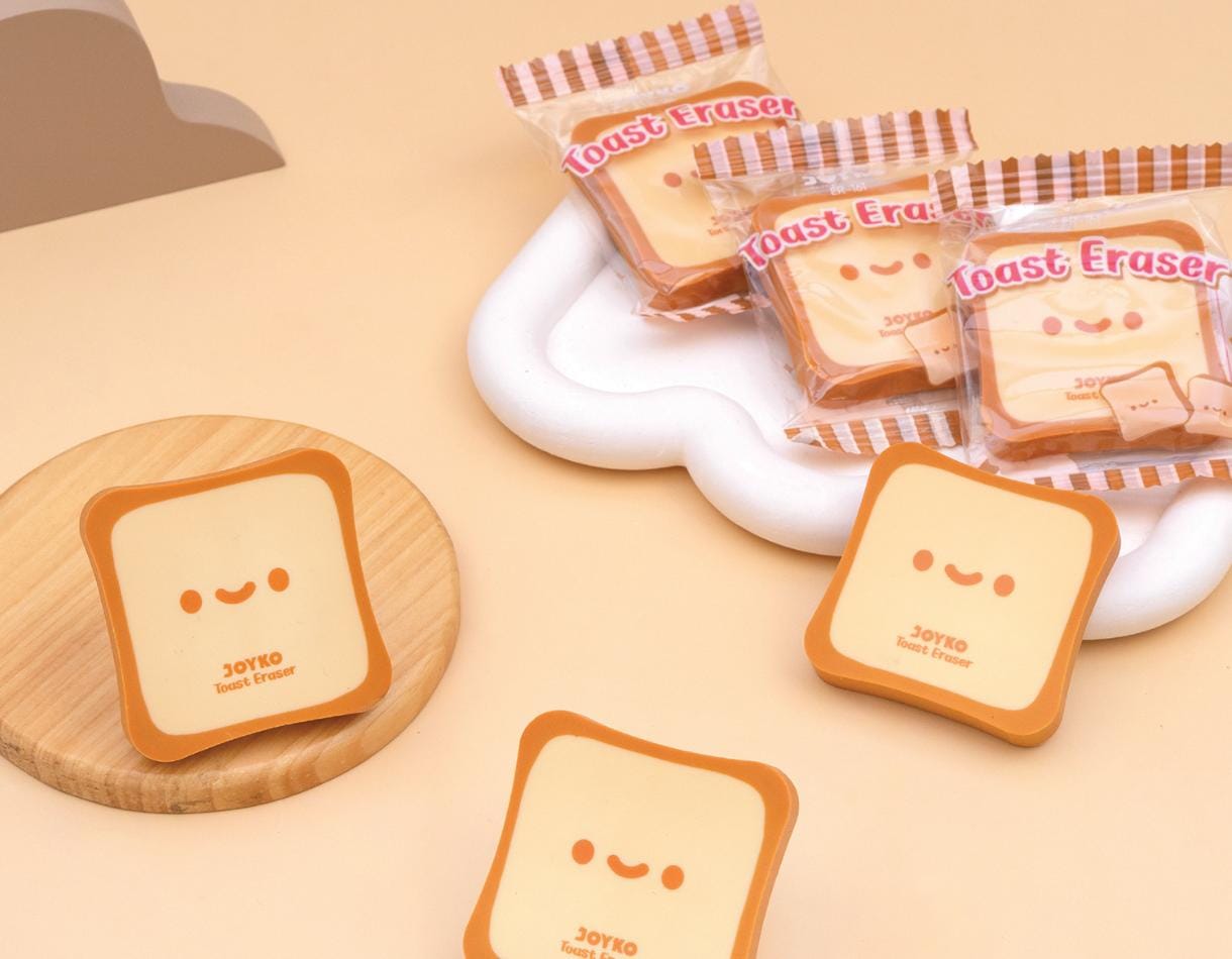 Kawaii toast-shaped erasers on a beige background
