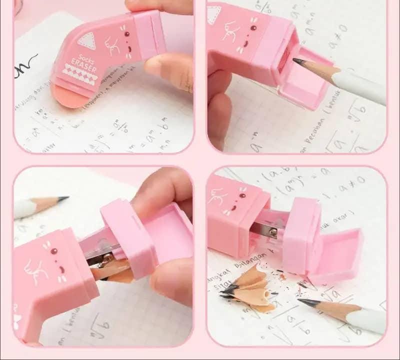 Pink pencil sharpener with cartoon design on a white background