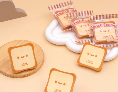 Kawaii toast-shaped erasers on a beige background