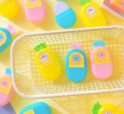 Colorful pineapple-shaped containers with cartoon faces on a yellow background