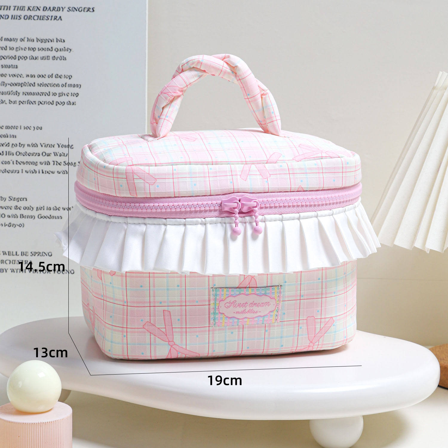 Pink and white checkered sewing basket on a white surface with measurements displayed.