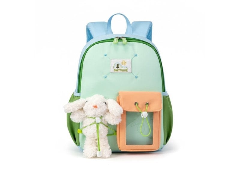 Children's backpack with a toy sheep attached on a white background