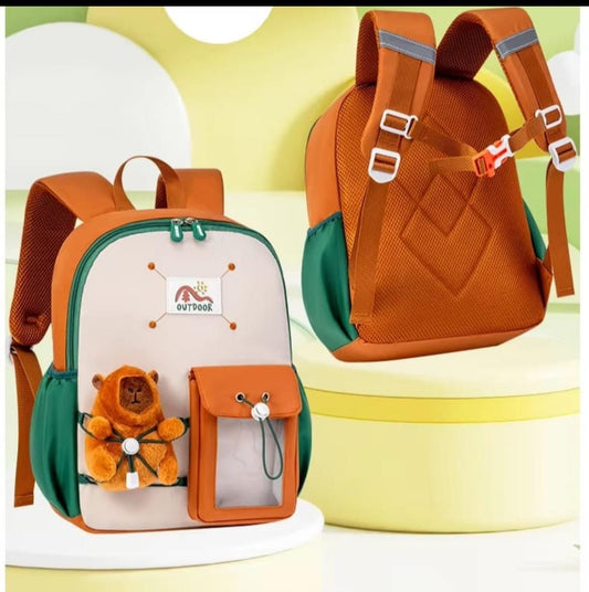 Orange and green backpack with teddy bear design on a colorful background